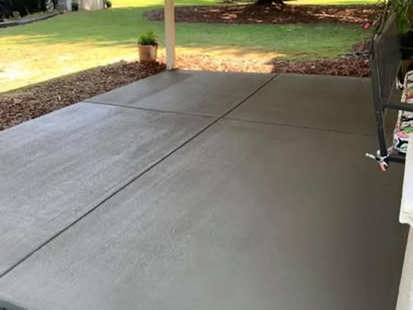 Broom-finished concrete driveway pad by Burton Concrete