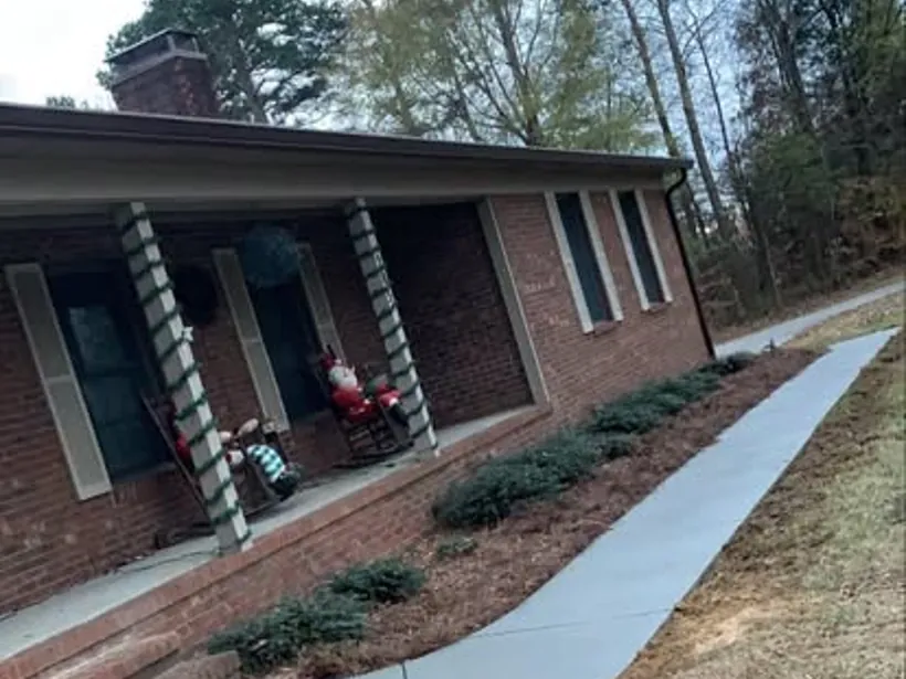 Concrete walkway and patio entry by Burton Concrete