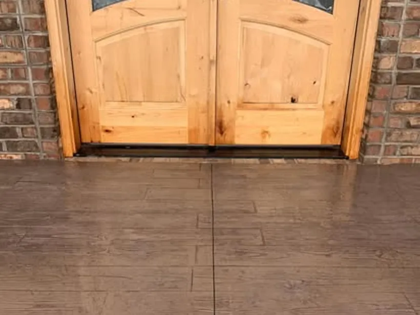 Wood-look stamped concrete entry by Burton Concrete